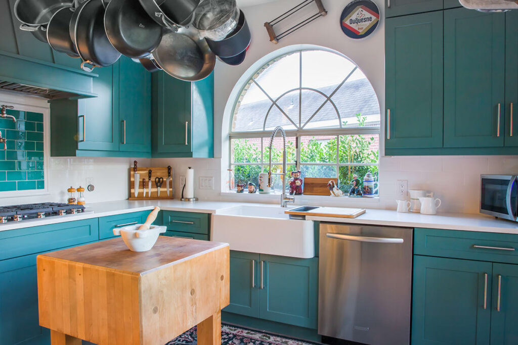 Kitchen with teal painted cabinets from Showplace Cabinetry