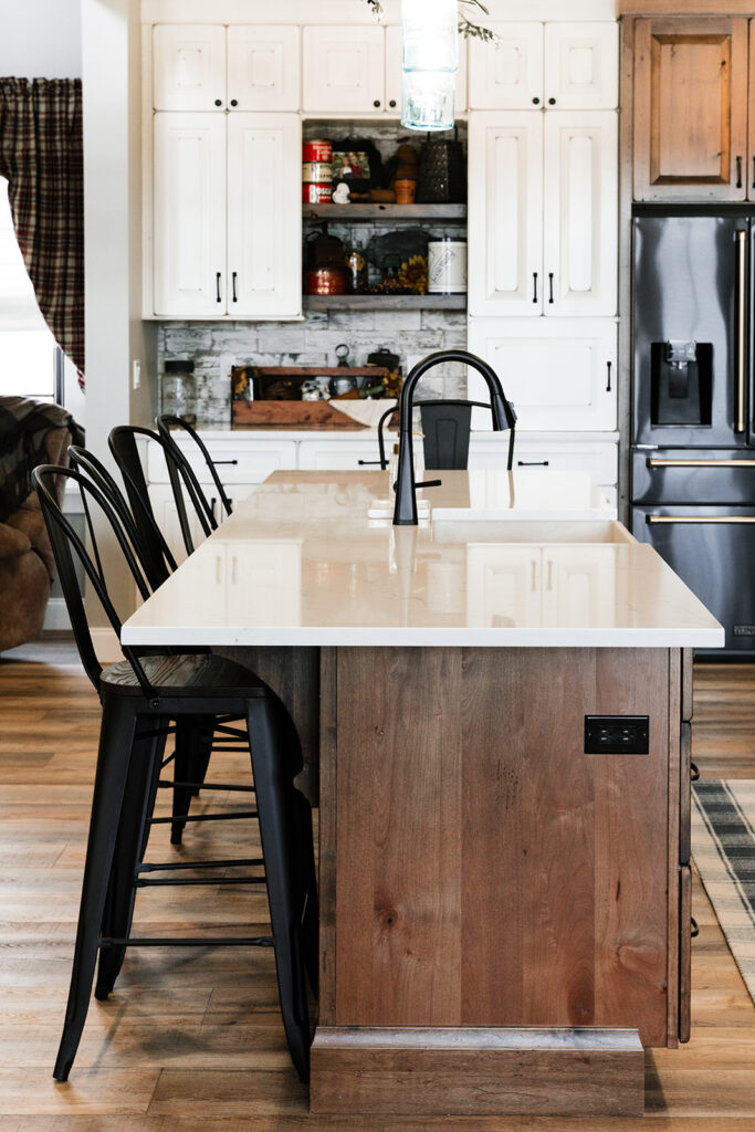 Long wood island with white countertop
