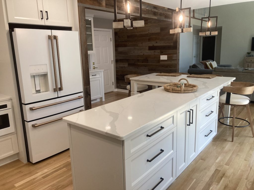 Built-in kitchen storage solutions including deep drawers, spice wall cabinet, and pullouts in full-access cabinetry