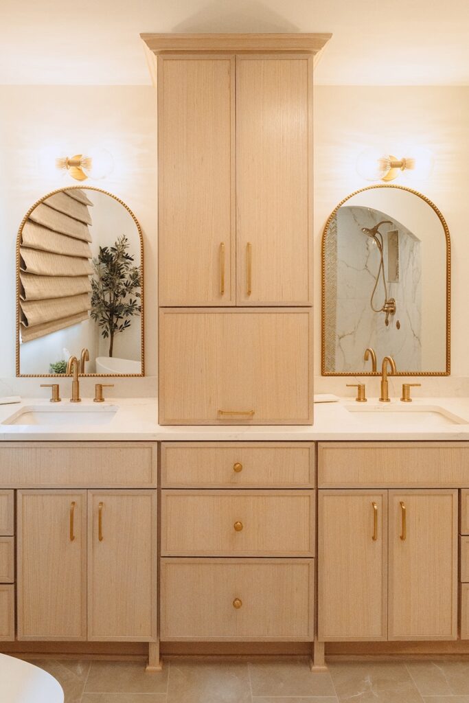 Front view of white oak bathroom vanity with tall cabinet.